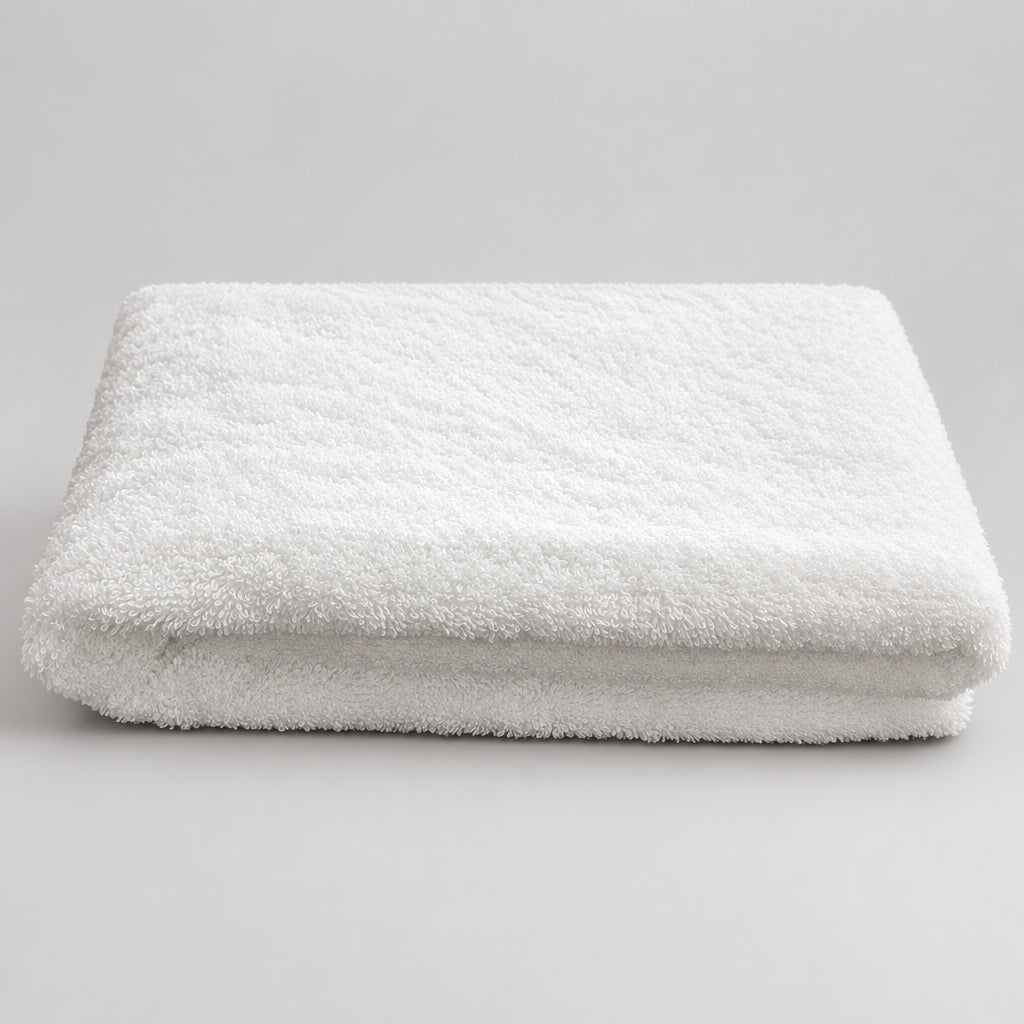 Home Bath Towel in white folded, soft terry surface