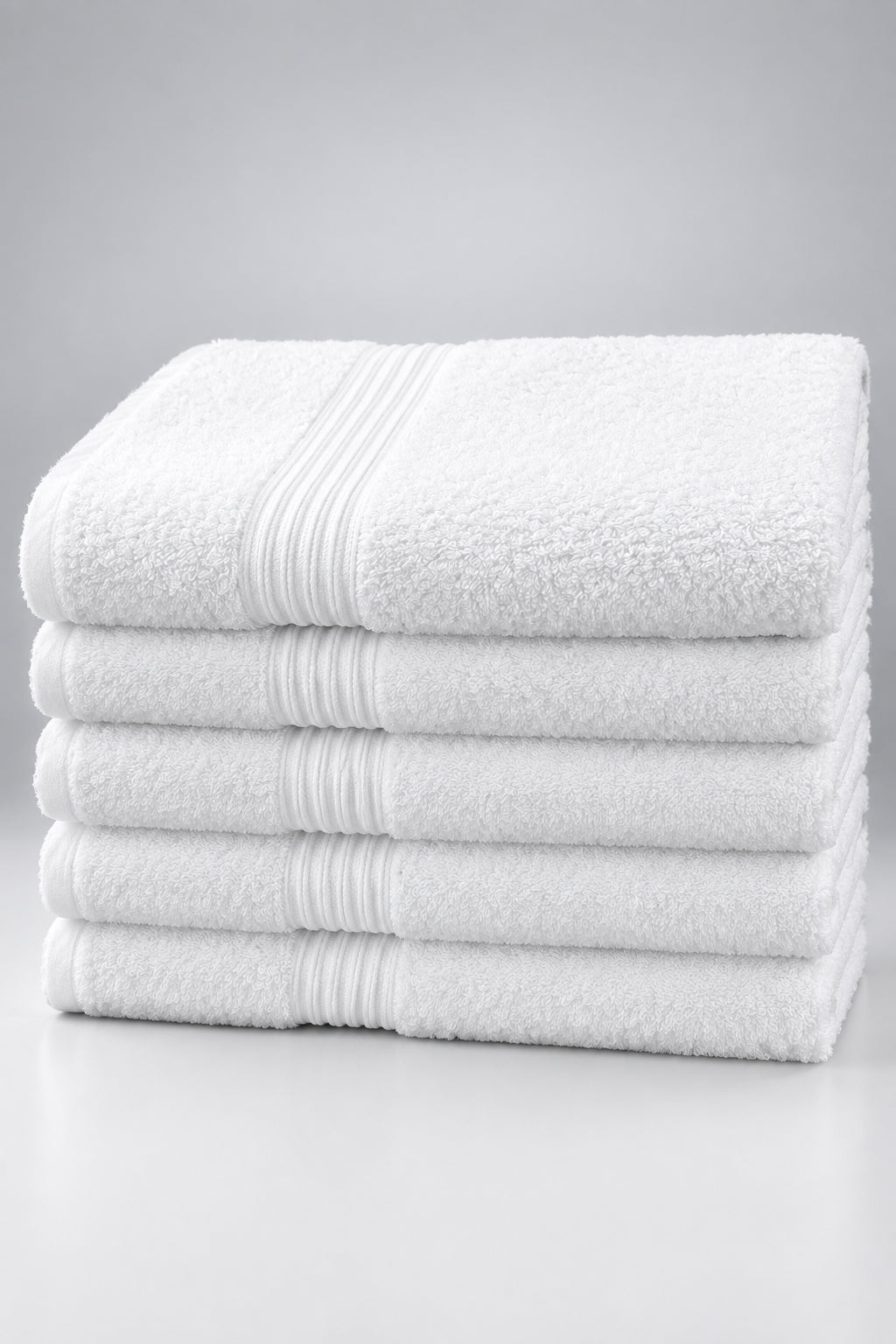 Stack of six Home Bath Towels in white with ribbed borders