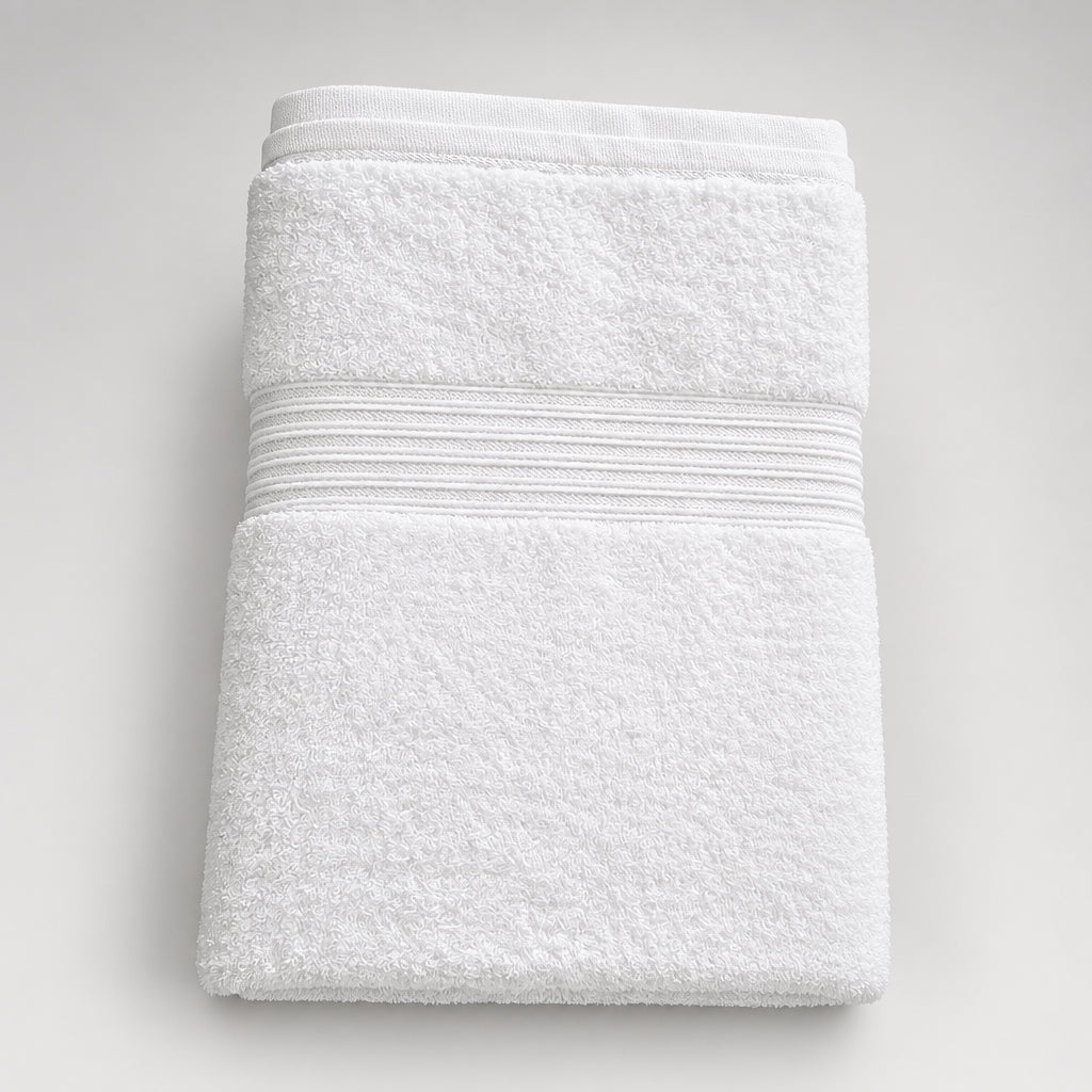 Home Bath Towel in white folded, with a horizontal ribbed band