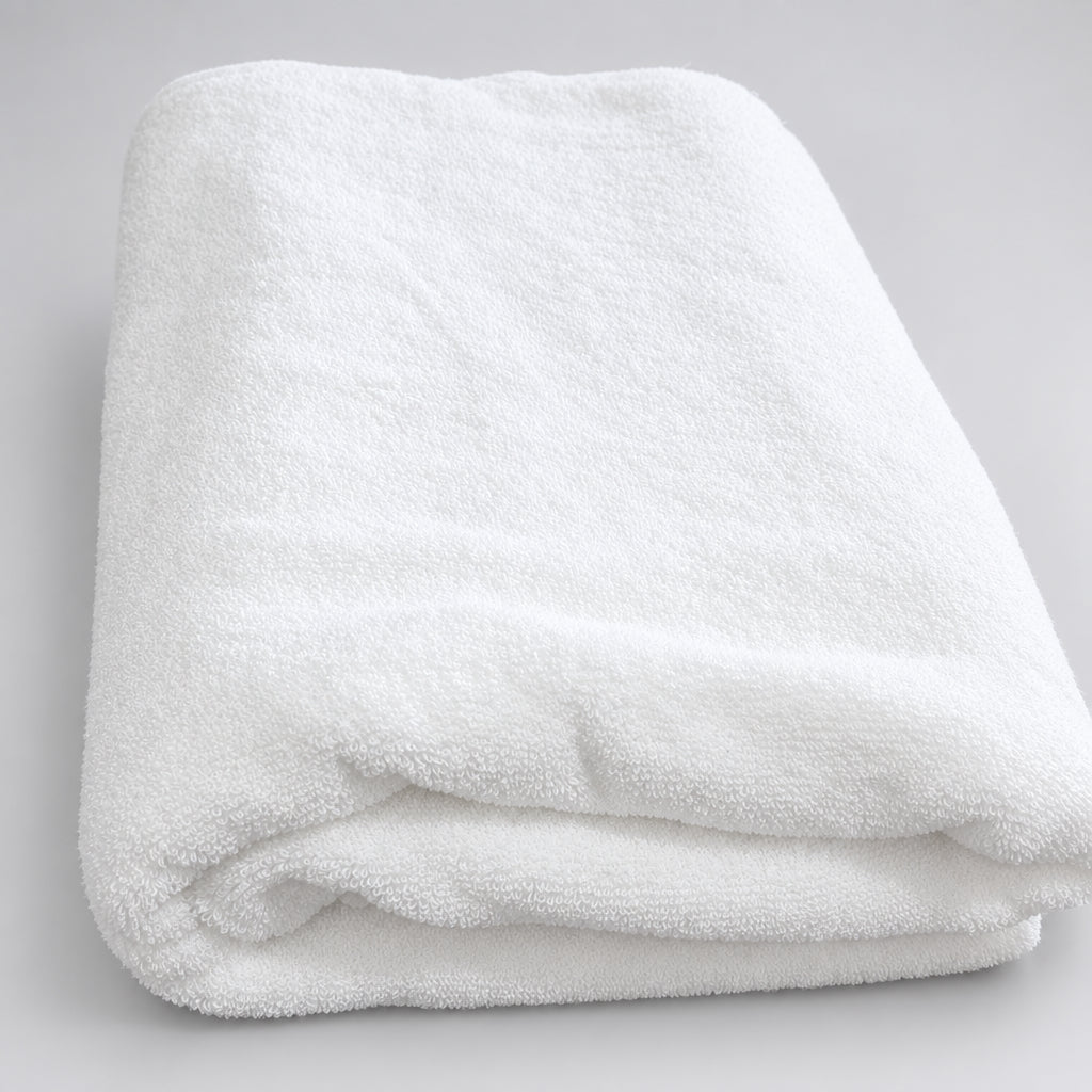 Hotel White Bath Towel folded, showing its creamy white terry