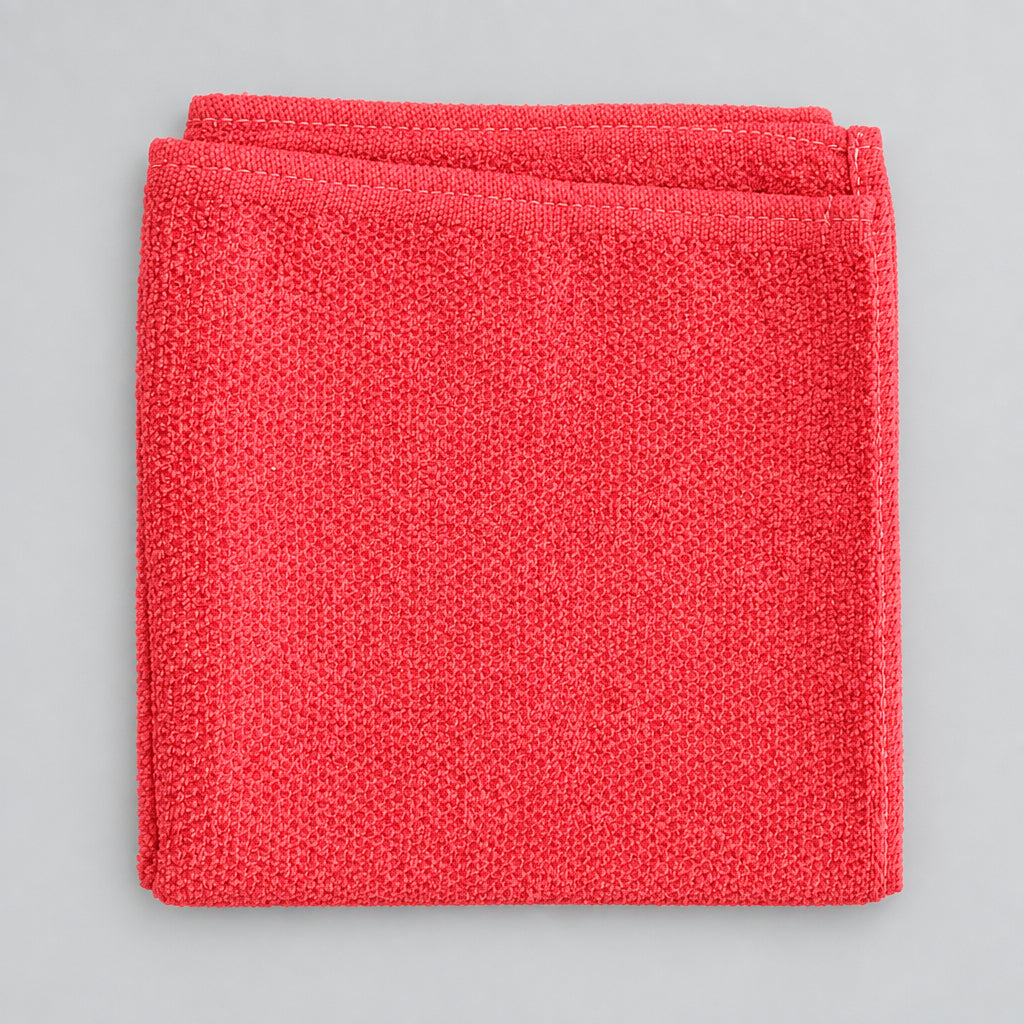 Coral Orange Loop Terry Kitchen Towel folded, textured weave