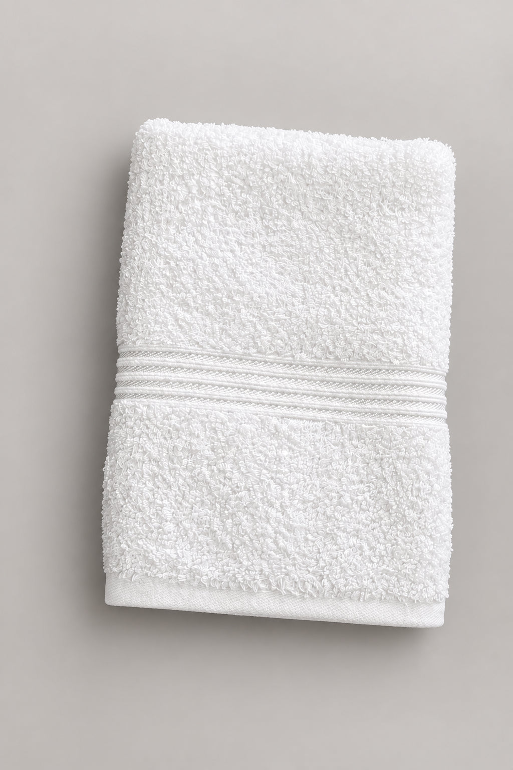 White Gym and Face Towel folded, showing the woven dobby band